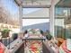 Relaxing covered porch with comfortable seating and colorful rug at 14543 Crosswater Ln, Charlotte, NC 28278