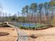 Community tennis court with surrounding fence at 14543 Crosswater Ln, Charlotte, NC 28278