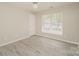 Spacious bedroom featuring a ceiling fan and large window at 1614 Hardy Dr, Rock Hill, SC 29732