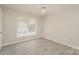 Bright bedroom with light flooring and large window at 1614 Hardy Dr, Rock Hill, SC 29732