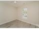 Well-lit bedroom with wood-look floors and window coverings at 1614 Hardy Dr, Rock Hill, SC 29732