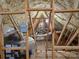 The attic's mechanicals and framing are clearly visible, and provide good storage capacity at 2510 Lentz Rd, China Grove, NC 28023