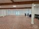 Spacious basement has brick-look floors and is partially finished with a walkout door at 2510 Lentz Rd, China Grove, NC 28023