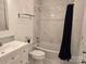 Bright bathroom features white marble tiling and a soaking tub with dark blue shower curtain at 2510 Lentz Rd, China Grove, NC 28023