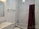 Elegant bathroom featuring a marble tile shower, chandelier, and modern vanity at 2510 Lentz Rd, China Grove, NC 28023