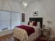 Charming bedroom with classic black accents, hardwood floors, and a decorative chandelier at 2510 Lentz Rd, China Grove, NC 28023