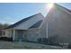 Sunny, beautiful brick home has covered porch and an expansive roof with black shingles at 2510 Lentz Rd, China Grove, NC 28023