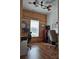 Comfortable home office with hardwood floors, wood-panel wall, and large windows at 2510 Lentz Rd, China Grove, NC 28023