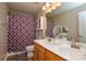 Double vanity bathroom with shower/tub and hardwood floor at 2510 Oakboro Ln, Charlotte, NC 28214