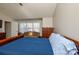 Main bedroom with sitting area and blue bedding at 2510 Oakboro Ln, Charlotte, NC 28214