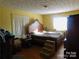 Bedroom featuring hardwood floors, a large bed frame, and natural light from the window at 2517 Lane St, Kannapolis, NC 28083