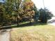 Property land featuring mature trees on a partially-sunny lot at 2517 Lane St, Kannapolis, NC 28083