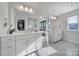 Bathroom featuring double vanity, with large mirrors, and a view into the main bedroom at 343 Embers Ln, Clover, SC 29710