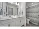 Bathroom featuring double sinks, white cabinets, and modern fixtures at 343 Embers Ln, Clover, SC 29710