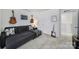 Cozy bedroom showcasing a comfortable gray couch, guitars, and stylish decor accents at 343 Embers Ln, Clover, SC 29710