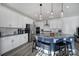 Modern kitchen boasts granite countertops, stainless appliances, a center island with seating and pendant lighting at 343 Embers Ln, Clover, SC 29710