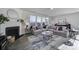 Well-lit living room with a fireplace and large sectional sofa at 343 Embers Ln, Clover, SC 29710