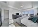 Main bedroom with tray ceiling, TV, and ensuite bathroom access at 343 Embers Ln, Clover, SC 29710