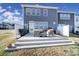 A backyard patio with an outdoor seating arrangement and a three-tier concrete platform at 343 Embers Ln, Clover, SC 29710