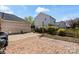This backyard has a brick patio with a manicured lawn and fence at 3507 Southern Ginger Dr, Indian Trail, NC 28079