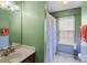 This bathroom features a shower and tub with a large framed mirror on the vanity at 3507 Southern Ginger Dr, Indian Trail, NC 28079