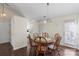 Dining area with hardwood floors located adjacent to kitchen and natural light at 3507 Southern Ginger Dr, Indian Trail, NC 28079