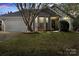 Charming single-story home with a gray exterior, two car garage and well-manicured lawn at 3507 Southern Ginger Dr, Indian Trail, NC 28079