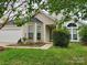 Charming one-story home featuring a bay window, well-maintained lawn, and a two-car garage at 3507 Southern Ginger Dr, Indian Trail, NC 28079