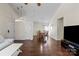 Open-concept living and dining area with hardwood floors and neutral color palette at 3507 Southern Ginger Dr, Indian Trail, NC 28079
