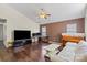 Living room with vaulted ceiling, hardwood floors, TV, and a comfortable seating area at 3507 Southern Ginger Dr, Indian Trail, NC 28079