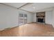 Living room with stone fireplace and sliding glass doors to backyard at 415 Trafalgar Pl, Matthews, NC 28105