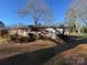 Brick ranch home with a sunroom and a deck in the backyard at 518 Glenn St, Chester, SC 29706