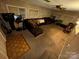 Living room with sectional sofa and flooring at 518 Glenn St, Chester, SC 29706