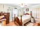 Cozy bedroom with wooden bed frame, matching nightstand, and natural light at 523 Eastway Ave, Kannapolis, NC 28083