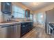 Well-lit kitchen featuring sleek stainless steel appliances and modern black cabinets at 544 Wakefield Dr, Charlotte, NC 28209