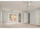 Large bedroom offers ceiling fan, carpeting, and access to a vanity area and a backyard deck at 622 Oakdale Dr, Statesville, NC 28677