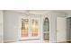 This bedroom has french doors to a deck, an arched doorway, and a vanity area at 622 Oakdale Dr, Statesville, NC 28677