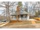 This home features a covered front porch and beautiful landscaping at 622 Oakdale Dr, Statesville, NC 28677