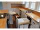 Bright kitchen features white cabinetry, wood countertops, stainless steel appliances, and convenient pull out drawers at 622 Oakdale Dr, Statesville, NC 28677