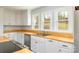 Kitchen featuring custom countertops, stainless steel appliances, and bright lighting at 622 Oakdale Dr, Statesville, NC 28677