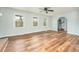 Open-concept living room with hardwood floors, arched entrance, and ample natural light at 622 Oakdale Dr, Statesville, NC 28677