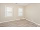 Spacious bedroom with hardwood floors and two windows at 637 Tysons Forest Dr, Rock Hill, SC 29732