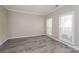 Spacious bedroom with hardwood floors and two windows at 637 Tysons Forest Dr, Rock Hill, SC 29732