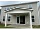 Covered back porch with sliding glass doors leading to the living room and backyard at 7120 Wayfarer Dr # 0079, Charlotte, NC 28269