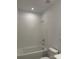 Clean, well-lit bathroom with tile surround shower and modern fixtures at 7120 Wayfarer Dr # 0079, Charlotte, NC 28269