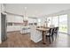 Open-concept kitchen and dining area features a central island, modern appliances, and ample seating at 7120 Wayfarer Dr # 0079, Charlotte, NC 28269