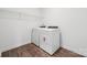 Spacious laundry room with a washer and dryer, wire shelving, and durable flooring at 7120 Wayfarer Dr # 0079, Charlotte, NC 28269