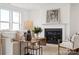Bright living room features a cozy fireplace, plush seating, and stylish decor accents at 7120 Wayfarer Dr # 0079, Charlotte, NC 28269