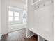 Well-organized mudroom featuring a built-in bench, storage, and seamless transition into a bright, airy room at 7120 Wayfarer Dr # 0079, Charlotte, NC 28269