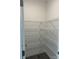 Walk-in pantry with white metal shelving for organization and storage at 7120 Wayfarer Dr # 0079, Charlotte, NC 28269